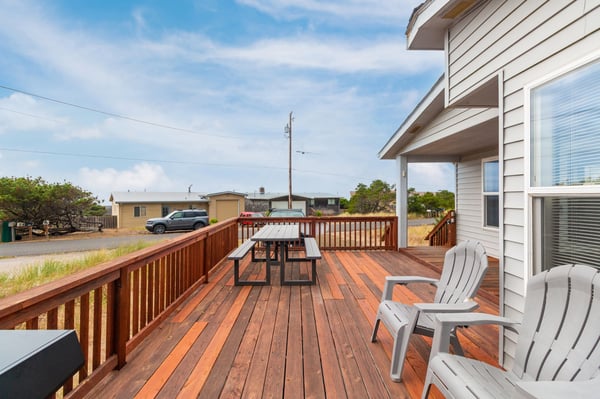 Your spacious deck invites you to gather around the picnic table or relax in Adirondack chairs, with plenty of room to enjoy warm coastal breezes and open skies.