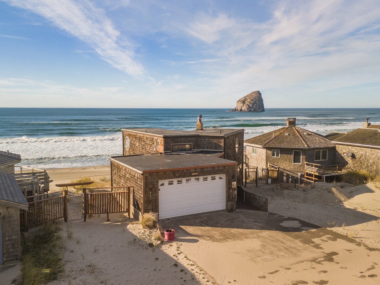 Beachfront property with direct ocean access and iconic Haystack Rock view from the Oregon coast.