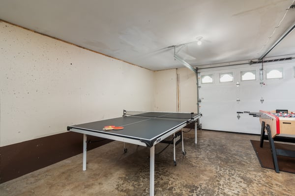 Challenge your friends to ping pong in this spacious game area, perfect for evening entertainment after exploring the area.
