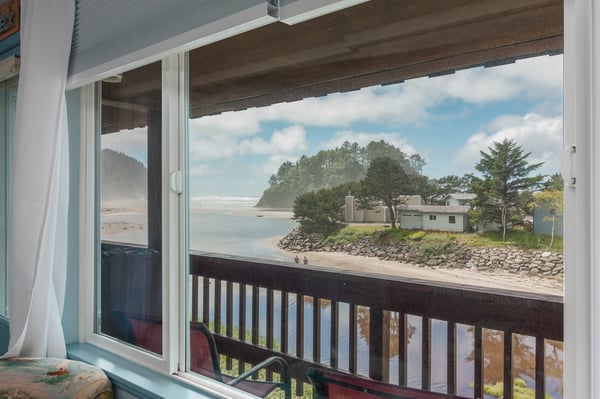 Open the door to sweeping coastal views where calm waters meet sandy shores. Your private balcony frames a serene beachfront scene, perfect for morning coffee or evening relaxation.