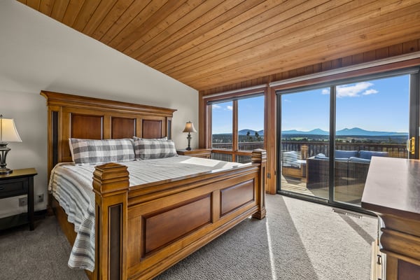 Wake up to breathtaking mountain views framed by warm wood and natural light. Your bedroom opens to a private balcony where morning coffee becomes a serene ritual.