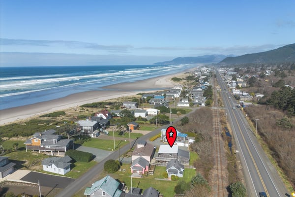 Coastal vacation rental positioned steps from pristine sandy beach and rolling Pacific waves.