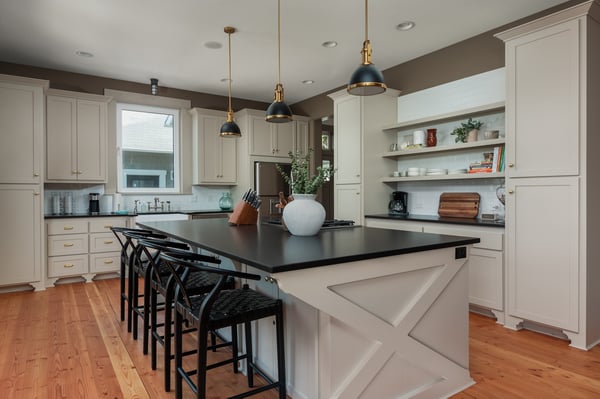 Picture yourself prepping meals in this bright, fully-equipped kitchen with sleek countertops, modern appliances, and a spacious island for gathering over morning coffee or evening wine.
