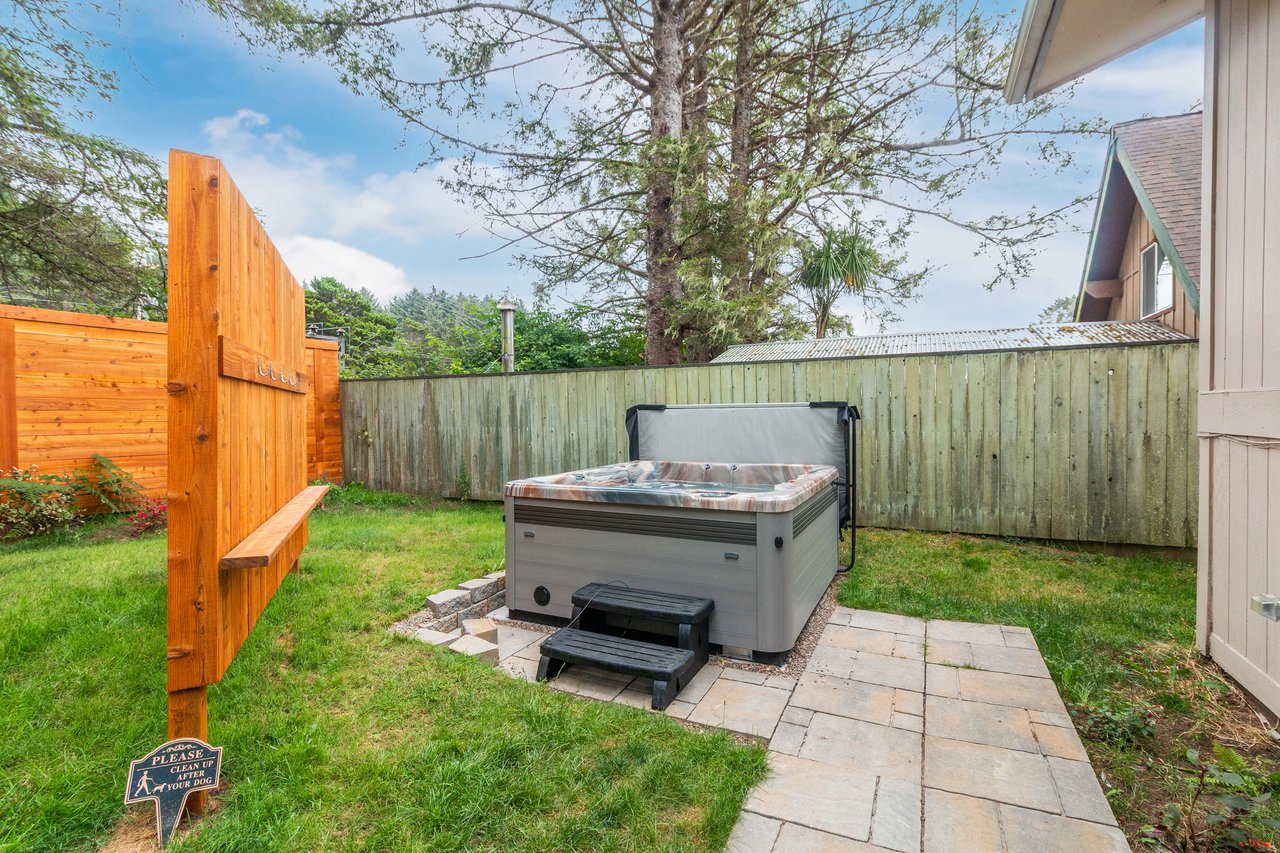 Soak away the day in your private hot tub, tucked into a peaceful backyard oasis with plenty of green space and fresh air.