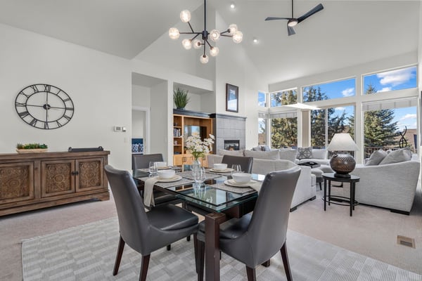 Relax in this elegant open-plan living space where your dining flows seamlessly into the cozy lounge, surrounded by natural light.