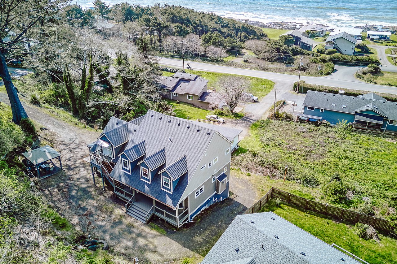 Coastal retreat nestled between forest and ocean, offering peaceful seclusion with easy beach access in a charming seaside community.