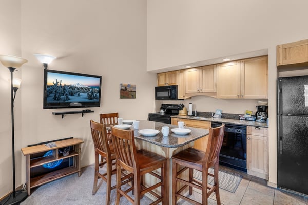 Step into your cozy kitchenette, perfectly set up for easy meals and relaxed evenings. The granite breakfast bar invites you to enjoy coffee while planning your day's adventures.