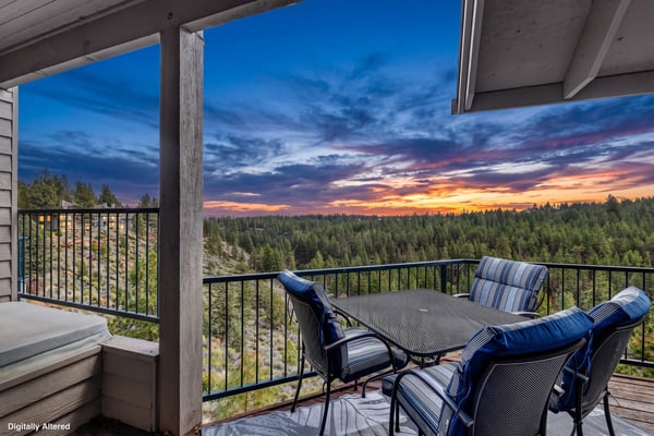 Watch the sunset paint the sky from your private balcony, where forest views stretch endlessly and evening relaxation awaits with comfortable seating for four.