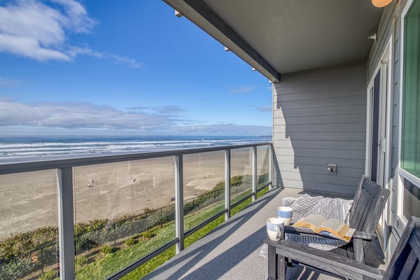 Unwind on your private oceanfront balcony with sweeping beach views, comfortable seating, and the soothing sounds of waves.