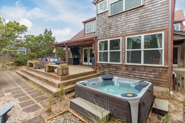 Soak away your cares in your private hot tub, then unwind on the spacious deck with seating and BBQ area.