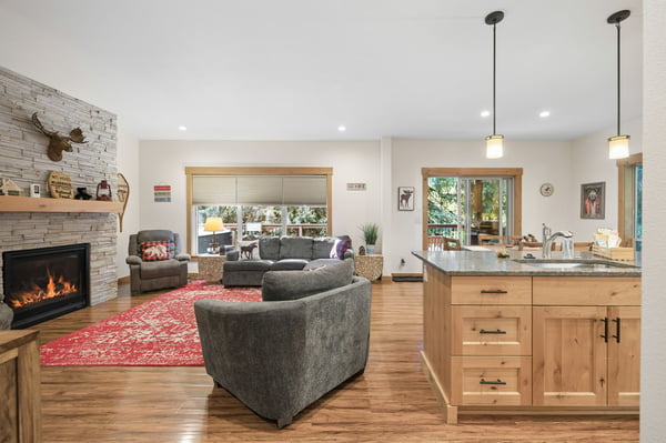 Relax in your open-concept retreat where a cozy fireplace meets a fully equipped kitchen, inviting you to unwind and create memories with friends and family.