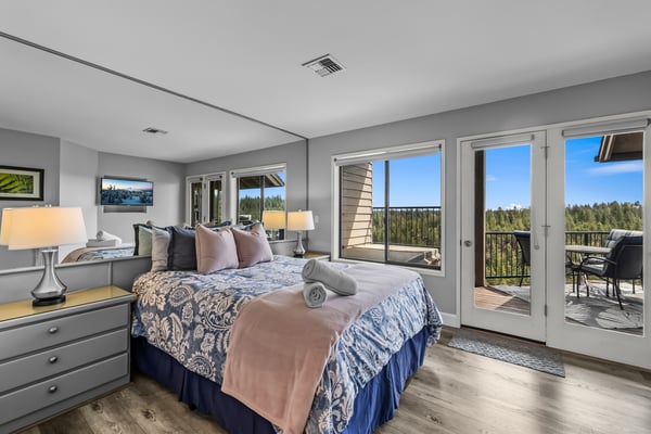 Wake up to sweeping forest views through floor-to-ceiling glass doors that open onto your private balcony, where the morning air is crisp and the pines stretch endlessly ahead.