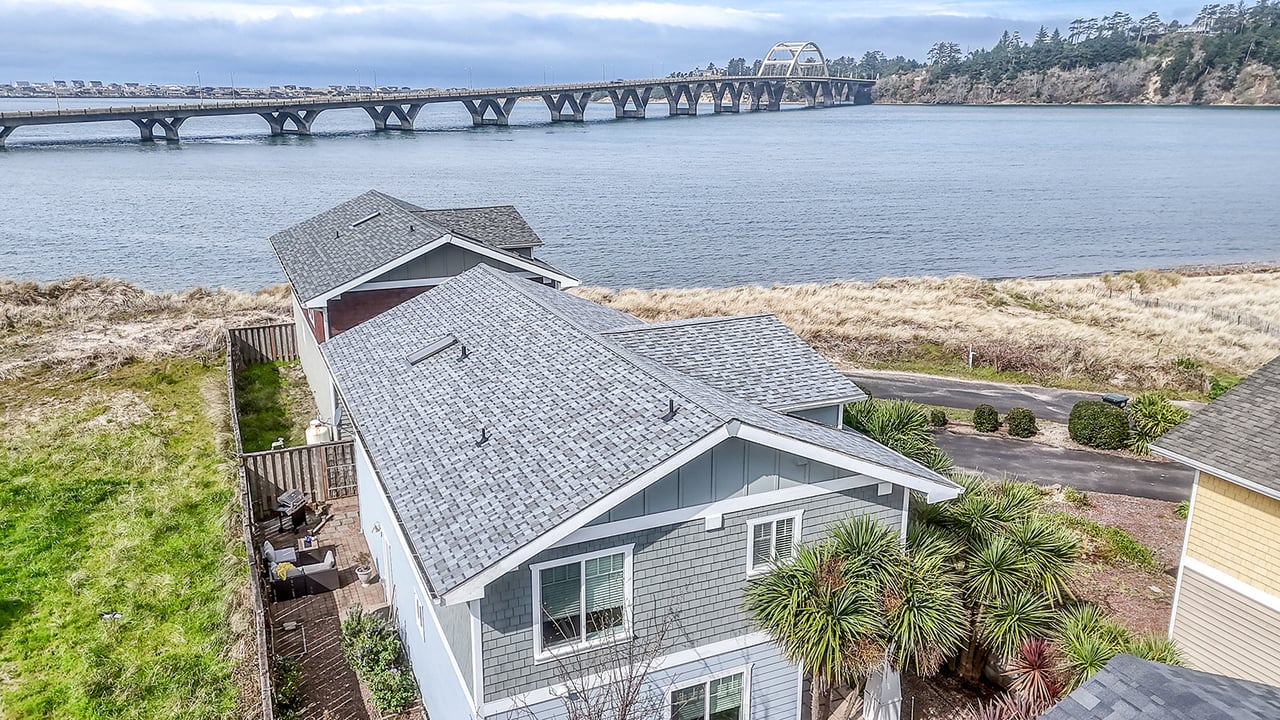 Waterfront property featuring stunning bridge views and coastal landscape from this elevated perspective.