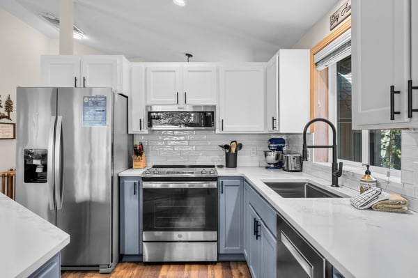 Modern, fully-equipped kitchen with stainless steel appliances and bright countertops—ready for your culinary adventures.