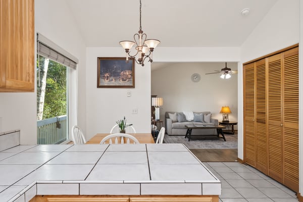 Step into an open, light-filled space where your kitchen flows seamlessly into a cozy living area—perfect for relaxing or hosting friends after exploring nearby attractions.