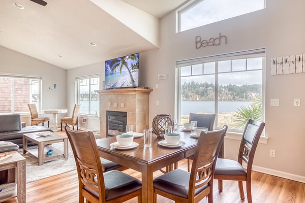 Enjoy meals with stunning water views through floor-to-ceiling windows in your bright, open dining space.