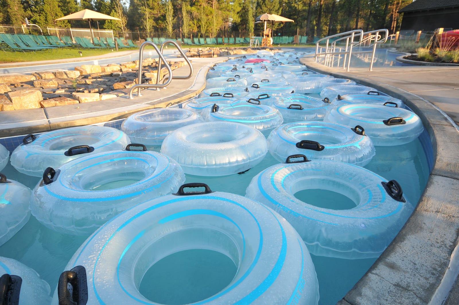 Central Oregon water park with many inner tubes floating in a pool