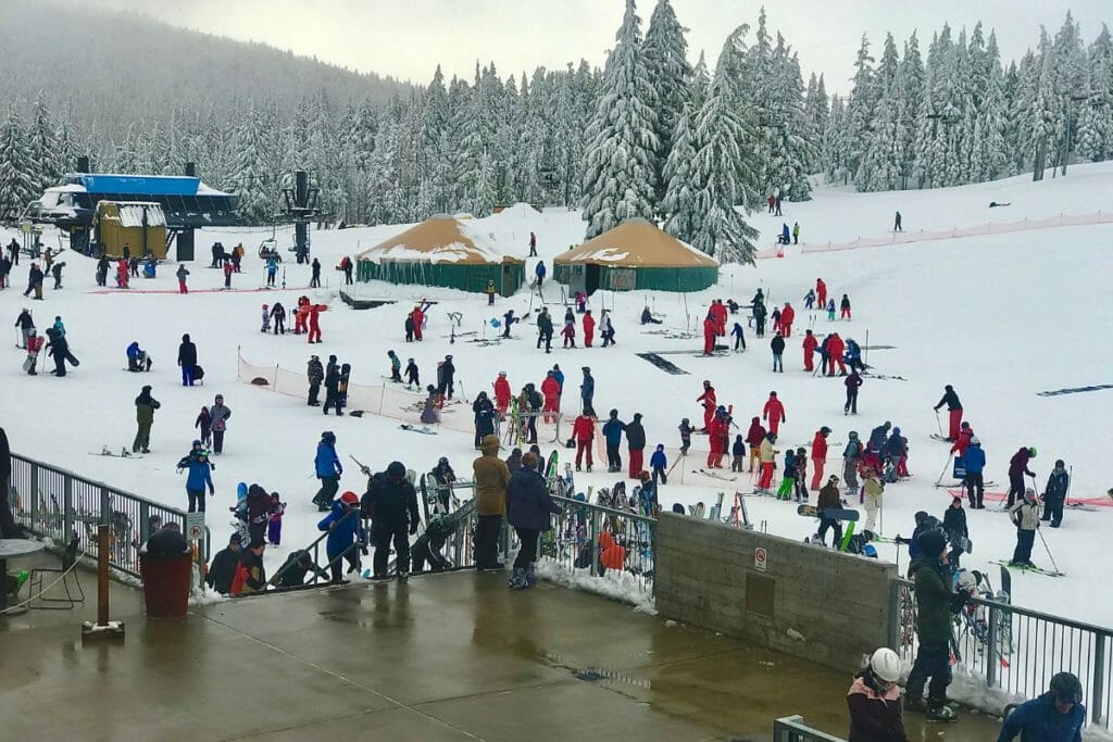 Crowd of skiiers at the lift on Mt Bachelor - skiing in Bend, OR